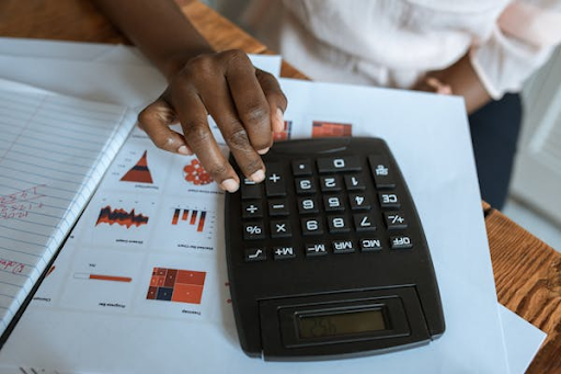 Accounting work life balance using a calculator and chart worksheet